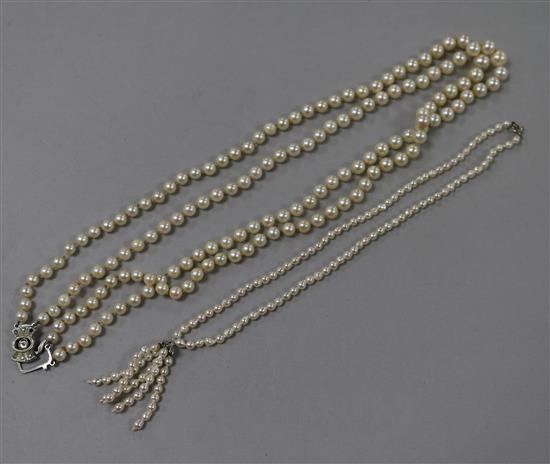 A double strand cultured pearl necklace and another baroque cultured pearl necklace, largest 52cm.